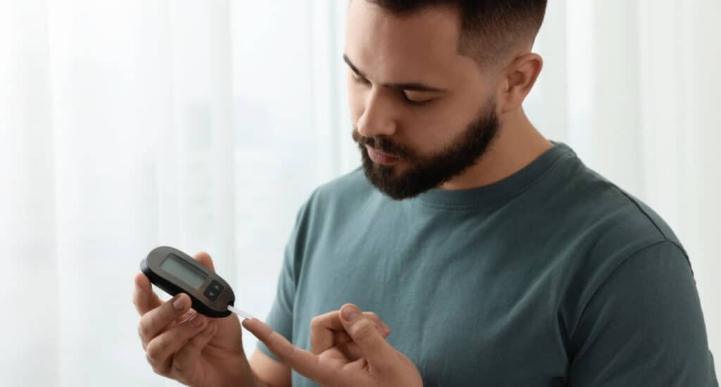Man Checking Blood Sugar Levels